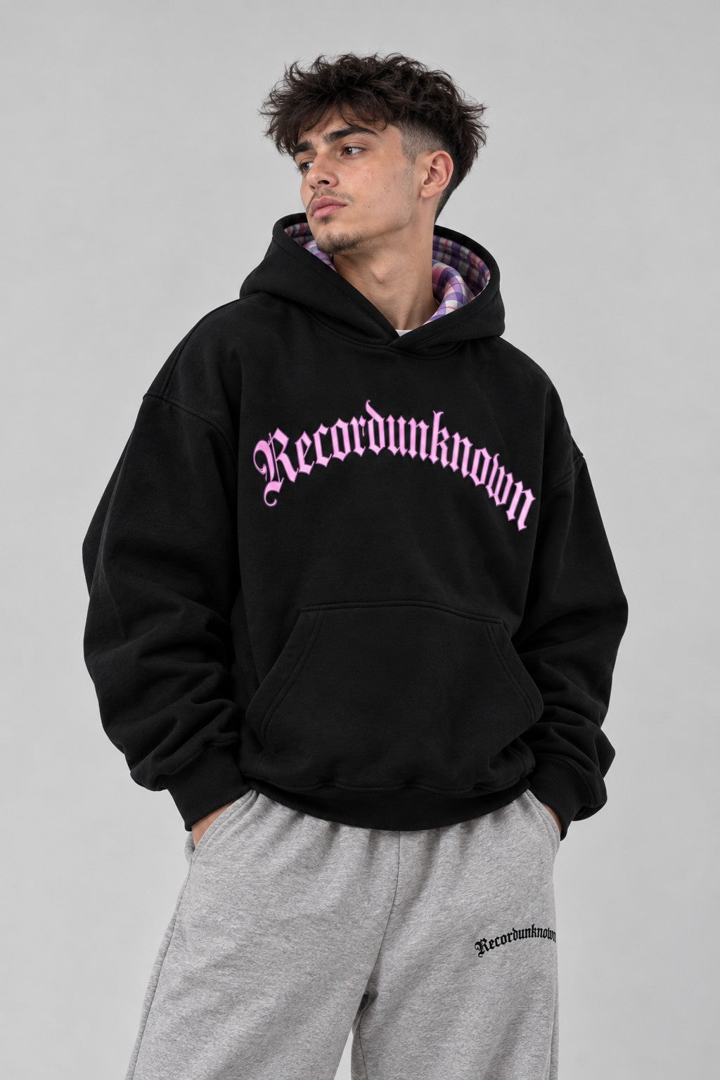 Close-up of the Recordunknown black flannel hoodie on a model