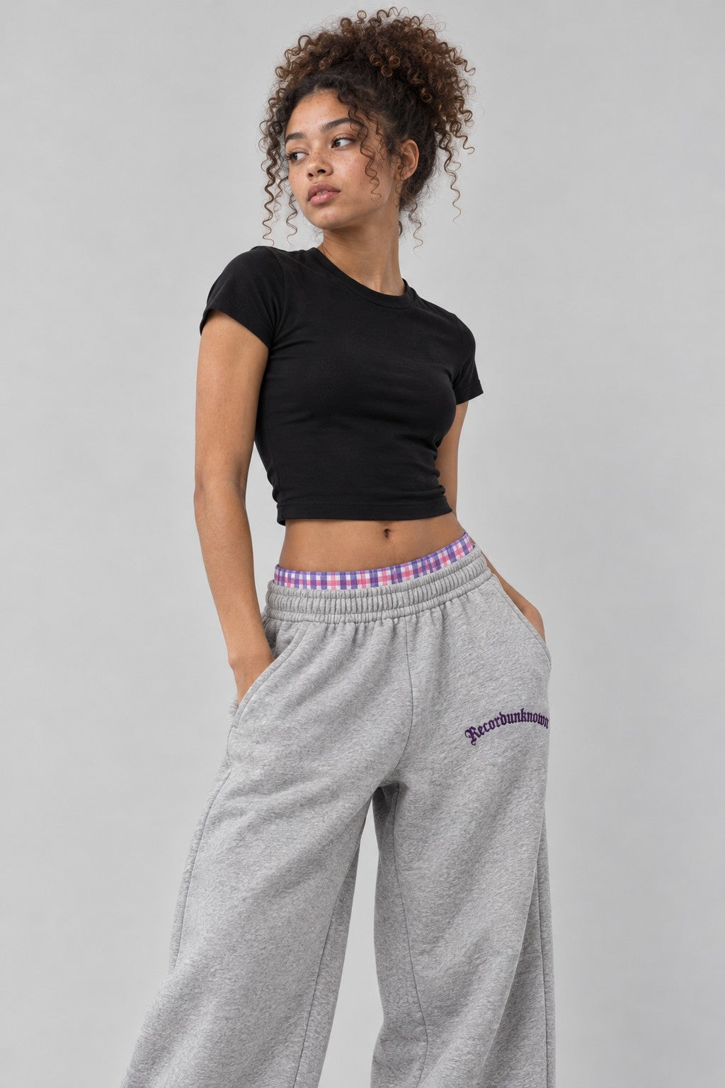 Close-up of the Recordunknown heather grey flannel sweatpants on a model