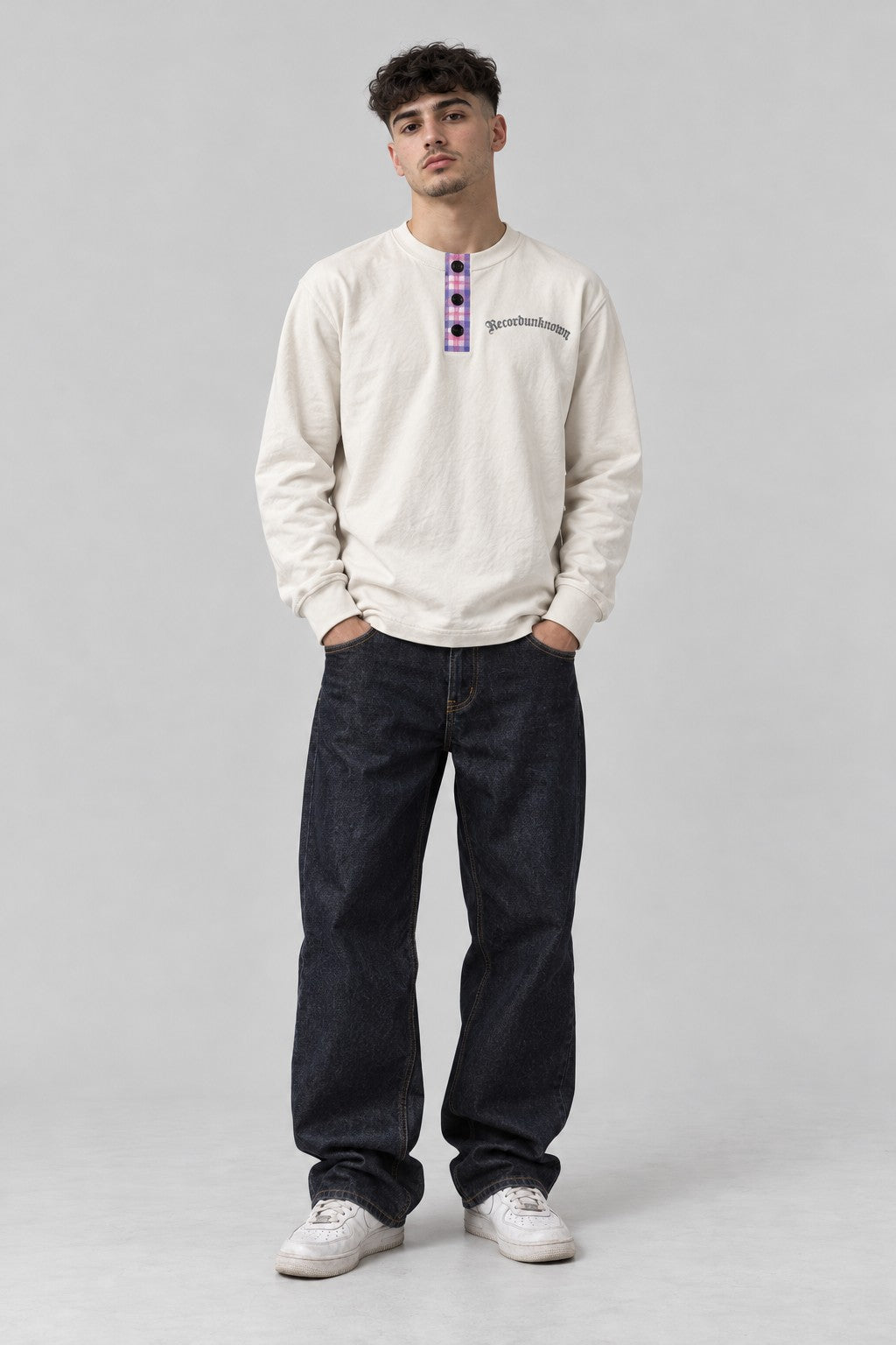 Model wearing the Recordunknown bone henley, full-length studio shot