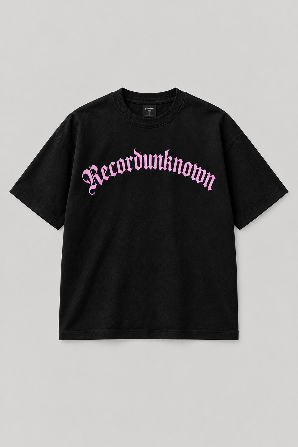 Recordunknown black oversized logo tee with baby-pink arched logo, front view