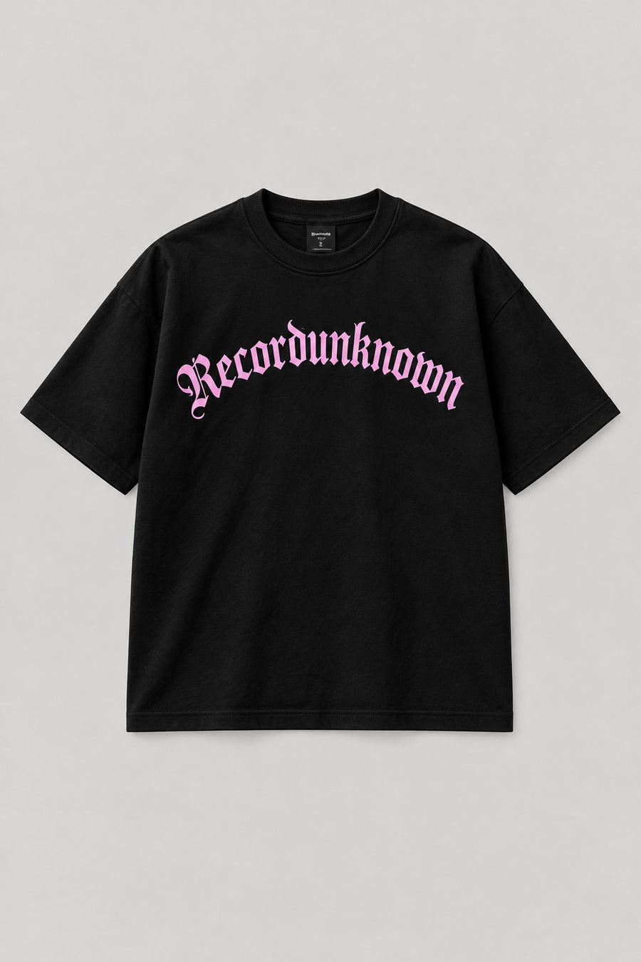 Recordunknown black oversized logo tee with baby-pink arched logo, front view