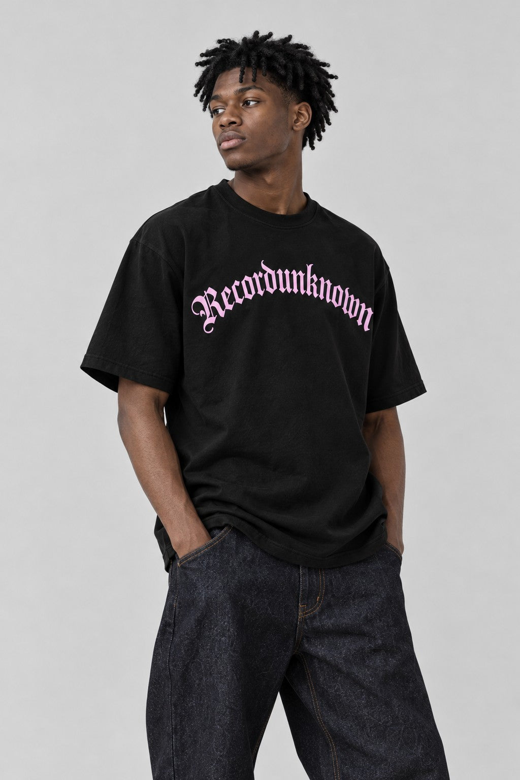 Close-up of the Recordunknown black logo tee on a model