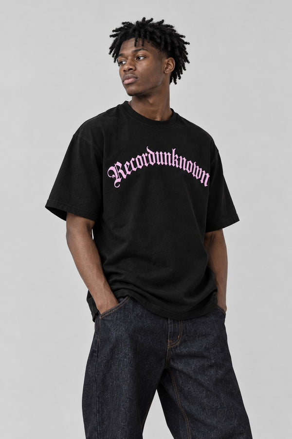 Close-up of the Recordunknown black logo tee on a model