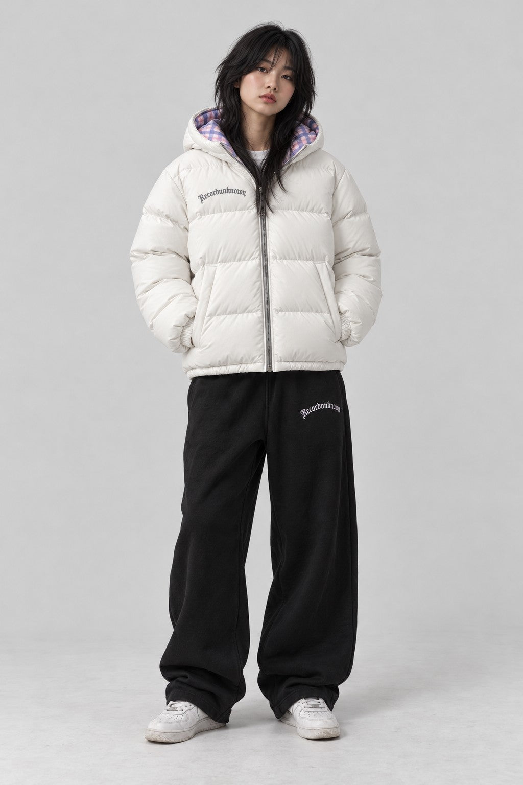 Model wearing the Recordunknown ice white puffer jacket, full-length studio shot