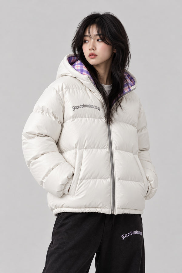 Close-up of the Recordunknown ice white puffer jacket on a model
