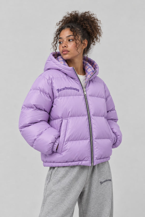 Close-up of the Recordunknown lilac puffer jacket on a model