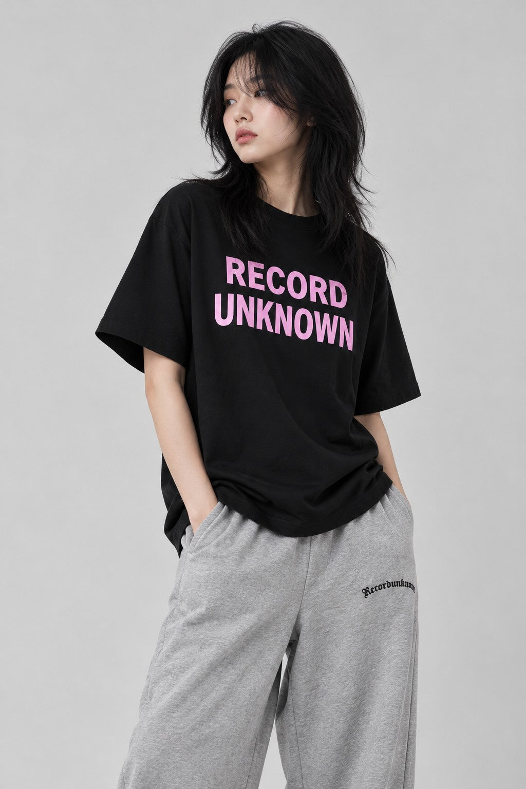 Close-up of the Recordunknown black stacked tee on a model
